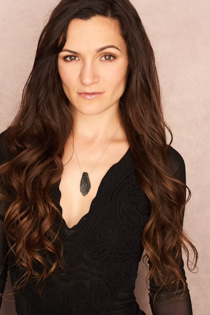 A professional portrait of Ashley Randall, Somatica Sex Coach and founder of Irreverent Scents, reflecting an atmosphere of intentional presence and modern elegance.